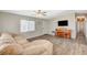 Living room features include wood flooring, a ceiling fan, and a comfortable couch at 425 Bonelli Ave, Overton, NV 89040