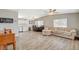 Spacious living room with wood flooring, neutral paint colors, ceiling fans, and lots of natural light at 425 Bonelli Ave, Overton, NV 89040
