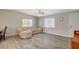 Cozy living room showcases wood floors, windows for natural light, and a comfortable couch at 425 Bonelli Ave, Overton, NV 89040