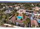 Aerial view of the property showcasing its pool, landscaping, and neighborhood at 4471 Borrego Springs Way, Las Vegas, NV 89129