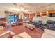 Comfortable living room featuring sofas, ceiling fan and access to the outside patio at 4471 Borrego Springs Way, Las Vegas, NV 89129