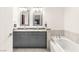 Bright bathroom featuring a double sink vanity with granite countertop and a soaking tub at 4575 Dean Martin Dr # 1103, Las Vegas, NV 89103