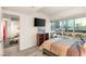 Neutral bedroom with skyline views, television, and wood-style floors at 4575 Dean Martin Dr # 1103, Las Vegas, NV 89103
