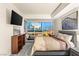 Modern bedroom with a skyline view, TV, sleek furniture, and neutral tones at 4575 Dean Martin Dr # 1103, Las Vegas, NV 89103