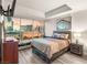 A primary bedroom boasts floor to ceiling windows with city views, a TV, and stylish furnishings at 4575 Dean Martin Dr # 1103, Las Vegas, NV 89103