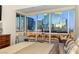 Bedroom view of the city skyline, a bed, work desk, and chair at 4575 Dean Martin Dr # 1103, Las Vegas, NV 89103