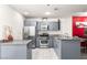 Bright kitchen with stainless steel appliances, granite countertops, and light gray cabinets at 4575 Dean Martin Dr # 1103, Las Vegas, NV 89103