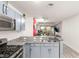 Modern kitchen featuring stainless steel appliances and granite countertops with a breakfast bar and city views at 4575 Dean Martin Dr # 1103, Las Vegas, NV 89103