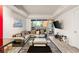 Bright living room featuring floor-to-ceiling windows with city views, contemporary furnishings, and a sleek TV at 4575 Dean Martin Dr # 1103, Las Vegas, NV 89103