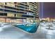 Relax by this beautiful pool with night lighting, along with a view of the building you will call home at 4575 Dean Martin Dr # 1103, Las Vegas, NV 89103