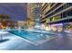 Enjoy the community pool area, complete with lounging chairs and palm trees at 4575 Dean Martin Dr # 1103, Las Vegas, NV 89103