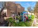Backyard featuring a large grassy area, play set, and mature trees providing plenty of shade at 4708 Royal Sunset Ct, Las Vegas, NV 89130