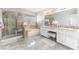 A bathroom with a shower, bath, and double sink at 4708 Royal Sunset Ct, Las Vegas, NV 89130