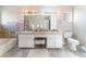 A bathroom with a tub and a double sink at 4708 Royal Sunset Ct, Las Vegas, NV 89130
