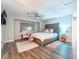 Cozy bedroom with a tufted headboard and neutral decor at 4708 Royal Sunset Ct, Las Vegas, NV 89130