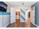 Bright bedroom featuring a blue accent wall, a closet, and a basketball hoop on the door at 4708 Royal Sunset Ct, Las Vegas, NV 89130