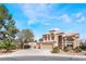 Charming two-story home boasts a three-car garage and desert landscaping at 4708 Royal Sunset Ct, Las Vegas, NV 89130