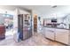 Open-concept kitchen with stainless steel appliances, ample storage, and a view of the living area at 4708 Royal Sunset Ct, Las Vegas, NV 89130