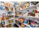 Walk-in pantry with ample shelving for food and storage at 4708 Royal Sunset Ct, Las Vegas, NV 89130