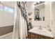 A clean bathroom with a shower-tub combo and vanity at 4944 Rita Dr, Las Vegas, NV 89121