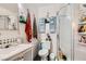 Functional bathroom with a shower, toilet, and sink with built in storage at 4944 Rita Dr, Las Vegas, NV 89121