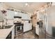 Well-equipped kitchen with stainless steel appliances, ample cabinetry, and a stainless refrigerator at 4944 Rita Dr, Las Vegas, NV 89121