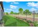 Expansive backyard with manicured lawn and decorative landscaping at 5095 E Long Leaf Ct, Pahrump, NV 89061