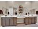 Bathroom with double sink vanity, two large mirrors, and modern sconces lighting at 5095 E Long Leaf Ct, Pahrump, NV 89061