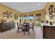 Stylish dining area showcasing a round table, elegant chairs, and a decorative wine rack at 5095 E Long Leaf Ct, Pahrump, NV 89061