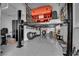 Garage featuring a car lift, custom flooring, and storage at 5095 E Long Leaf Ct, Pahrump, NV 89061