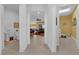 Open hallway showcasing the home's spacious layout, connecting to the living and service areas at 5095 E Long Leaf Ct, Pahrump, NV 89061