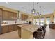 Open kitchen with a spacious island, stainless steel appliances, and a breakfast bar at 5095 E Long Leaf Ct, Pahrump, NV 89061