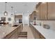Well-equipped kitchen featuring stainless steel appliances and a large center island with a sink at 5095 E Long Leaf Ct, Pahrump, NV 89061