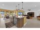 Spacious kitchen island seamlessly connects to a bright dining area and a comfortable living room at 5095 E Long Leaf Ct, Pahrump, NV 89061