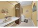 Well-organized laundry room with a sewing machine, washer, dryer, and ample storage at 5095 E Long Leaf Ct, Pahrump, NV 89061