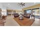 Expansive living room featuring an open layout to the kitchen and an outdoor view at 5095 E Long Leaf Ct, Pahrump, NV 89061