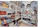 Organized walk-in pantry with extensive shelving for food and household storage at 5095 E Long Leaf Ct, Pahrump, NV 89061