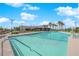 Large outdoor pool with palm trees at 5095 E Long Leaf Ct, Pahrump, NV 89061