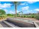A sleek water feature enhances the outdoor space by the pool area at 5095 E Long Leaf Ct, Pahrump, NV 89061