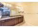 This is a bathroom featuring double sinks, granite counters and a glass-enclosed shower at 5350 Tulip Hill Ave, Las Vegas, NV 89141