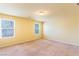 This is a spacious bedroom featuring two windows and neutral decor at 5350 Tulip Hill Ave, Las Vegas, NV 89141