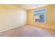 Bright bedroom with neutral carpet and a window offering natural light at 5350 Tulip Hill Ave, Las Vegas, NV 89141