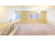 Upstairs bonus room featuring neutral carpet and natural light from the windows at 5350 Tulip Hill Ave, Las Vegas, NV 89141