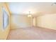 Large bonus room with neutral carpet and ample natural light from the windows at 5350 Tulip Hill Ave, Las Vegas, NV 89141