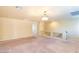 Open bonus room with neutral carpet, chandelier, and a view of the staircase at 5350 Tulip Hill Ave, Las Vegas, NV 89141