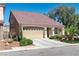 Charming single-story home with a well-maintained lawn and a private driveway, featuring a tile roof at 5350 Tulip Hill Ave, Las Vegas, NV 89141