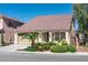 Inviting single-story home with lush landscaping, manicured shrubbery, and a spacious two-car garage at 5350 Tulip Hill Ave, Las Vegas, NV 89141