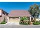 Charming single-story home featuring a two-car garage, landscaped yard, and a tile roof at 5350 Tulip Hill Ave, Las Vegas, NV 89141