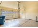 Spacious two-car garage featuring an automatic door opener, ample lighting, and clean, epoxy flooring at 5350 Tulip Hill Ave, Las Vegas, NV 89141