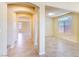 Hallway with arched doorways and tile flooring which offers views to other rooms in the house at 5350 Tulip Hill Ave, Las Vegas, NV 89141